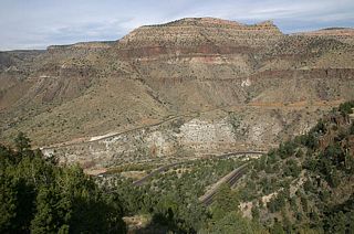 These photos were taken from an abandoned rest area on an old alignment of US 60, and have an excellent view of the grade and the twin Salt River bridges at the bottom of the canyon.