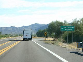 Turn left here to reach Queen Valley Road and Whitlow Dam. Whitlow Dam is a flood control dam on Queen Creek, which US 60 parallels.