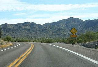 US 60 has many curves along Queen Creek. This section 
                        of road was first constructed in 1929, and rebuilt between 
                        1948 and 1952.