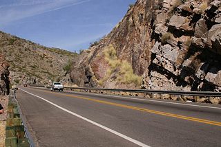 The reconstructed US 60 passes through numerous road cuts, cut from the sheer rock faces above Queen Creek.