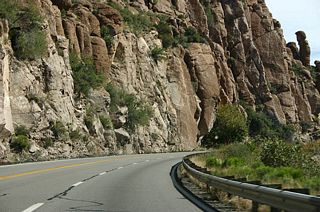 US 60 passes under sheer road cuts just to the north of the road.
