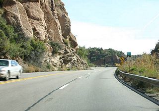 US 60 is the Gila-Pinal Scenic Road between Miles 214.5 and 240.5. The road is signed with the Arizona standard scenic road marker, as seen here.