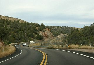 US 60 continues to twist and turn as it makes the final climb out of the Salt River Canyon, into high mountainous terrain.