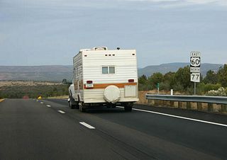 US 60 remains co-signed with SR 77 as it reaches the top of the Mogollon Rim.