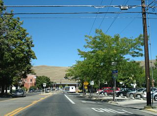 The final reassurance marker for U.S. 93 Business precedes Alder Street, where Orange Street reduces to two lanes.