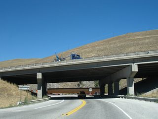 Orange Street north defaults onto I-90/MT 200 west. Signage for U.S. 93 Business ends here, with I-90 carrying the route back to U.S. 93 (Exit 101).