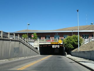 Constructed in the 1930s, the steel stringer bridge supporting the original Northern Pacific Railway is 250 feet in length and 396 feet wide. Orange Street travels 1,032 feet through the subway with two 15 foot lanes. A pair of five foot sidewalks accompany U.S. 93 Business through the Orange Street Underpass as well.1