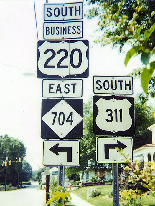 North Carolina - U.S. Highway 311, State Highway 704, and U.S. Highway 220 sign.